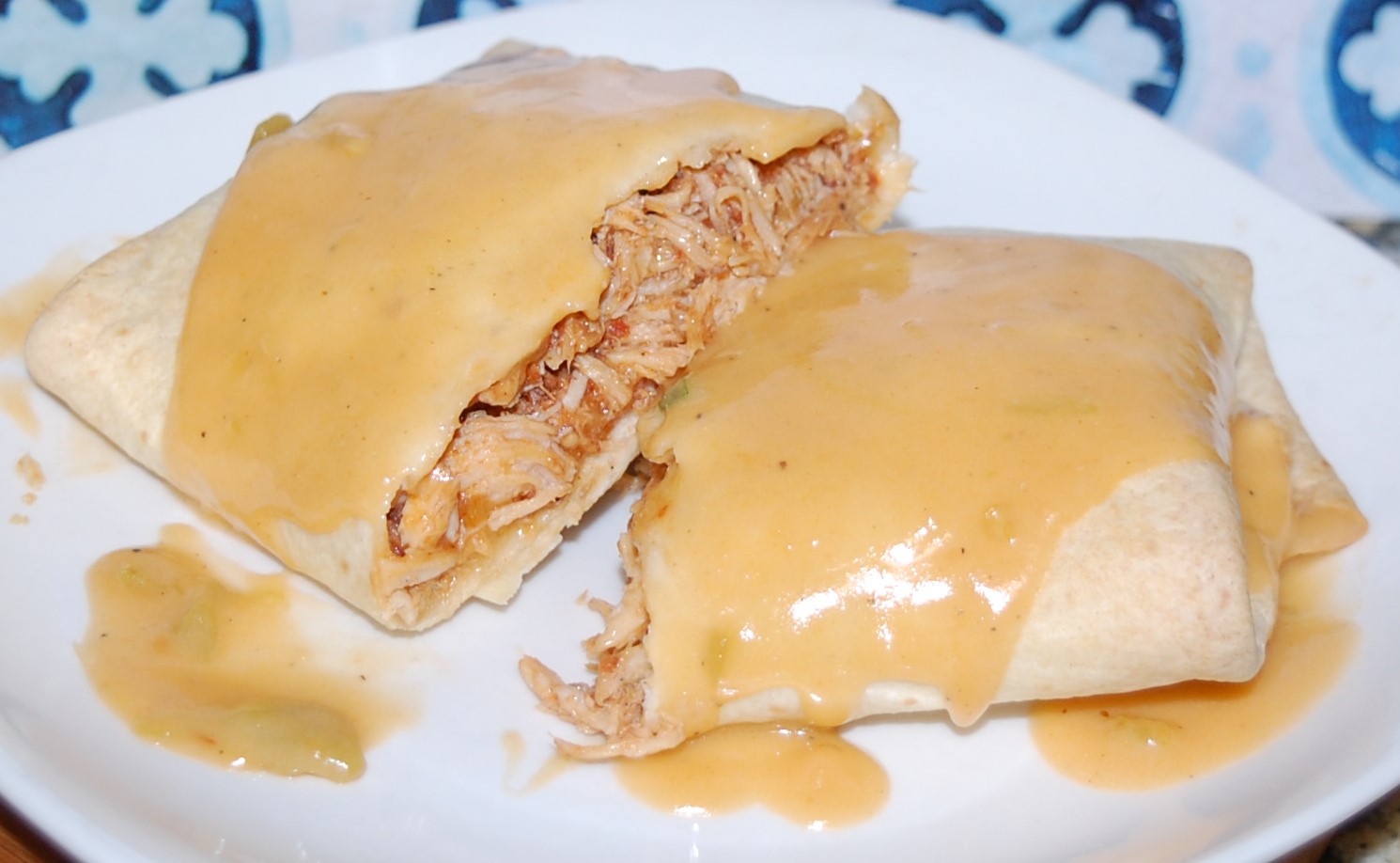 Smothered Baked Chicken Burritos - StolenRecipes.net