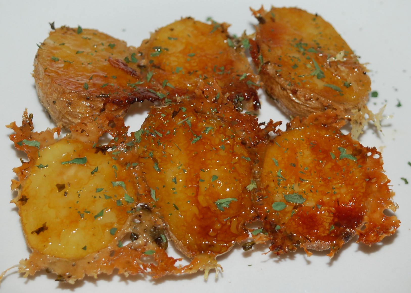 Parmesan Crusted Roasted Potatoes - StolenRecipes.net